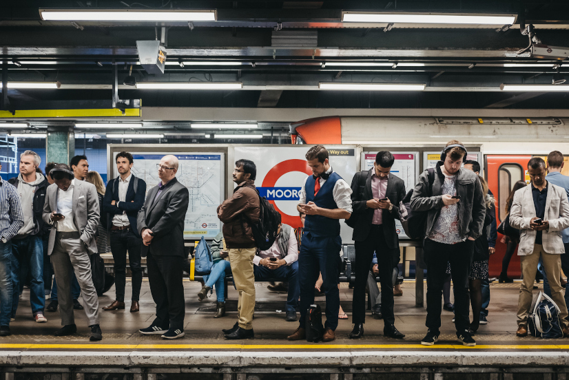 People on a platform of Moorgate station of London Underground, trains delayed. London Underground is the oldest underground railway in the world.